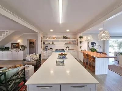 a kitchen with a large island in a room at Moonlight in Hermanus