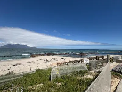a beach with a view of the ocean at Serenity suite 6 minutes away from the beach in Cape Town