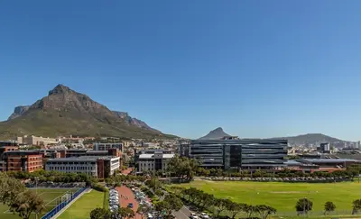 a city with a mountain in the background at Riverlands, Observatory, Luxury 1 Bed with views in Cape Town