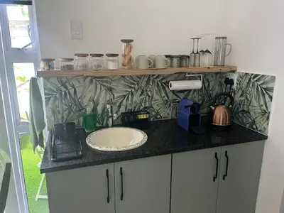 a bathroom counter with a sink and a counter top at carol close1 small apartment in Eversdal