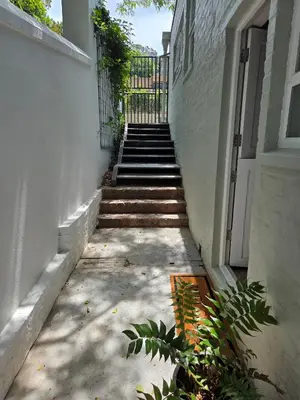a stairway leading up to a building with a door at SleepINN at Dumont in Paarl