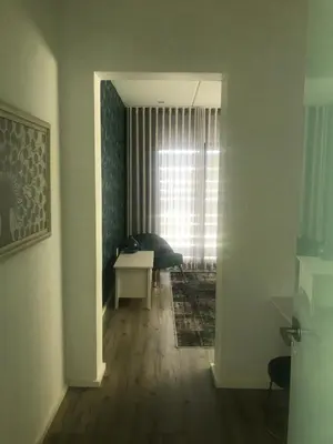 a hallway with a room with a table and a window at Luxury Family Home in Helderberg