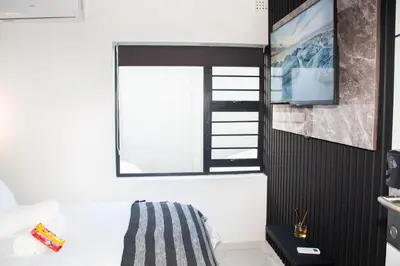 a room with a bed and a window at Willow Brooks in Cape Town
