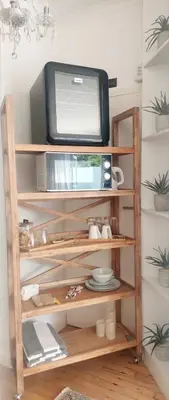 a television sitting on a shelf with a tv at LaPlace in Strand