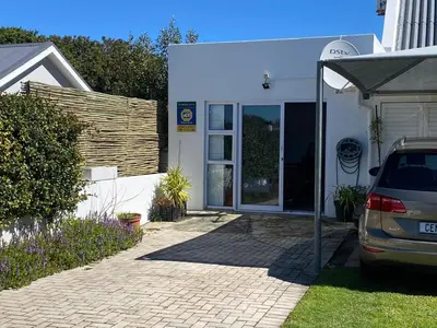 a car parked in front of a house at Skurwejantjie in Hermanus
