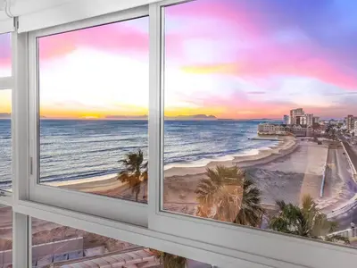 a view of the beach from a window at sunset at Sandy Shores On Beach - 709 in Strand