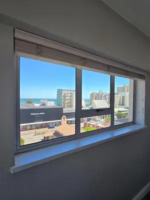 a window in a room with a view of a city at Panorama Sea and Mountain Views in Strand