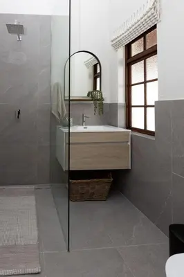 a bathroom with a sink and a mirror at Villa Canetsfontein in Wellington