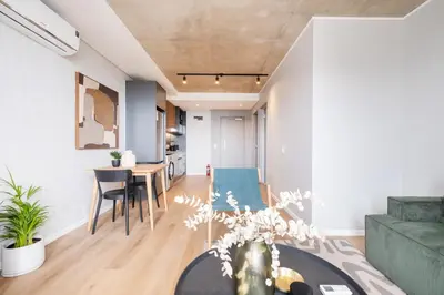 a living room with a couch and a table at 309 Riverlands - Lux 1 Bedroom Apartment in Cape Town