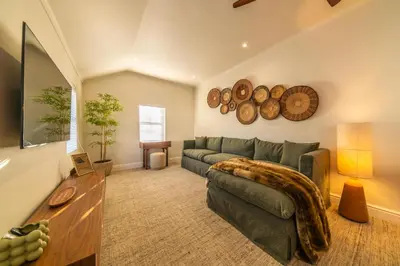 a living room with a couch and a table at The Nest Franschhoek in Franschhoek