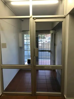 a view through a glass door into a hallway at Relaxing Hideaway in Strand