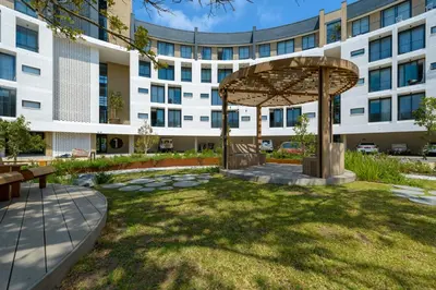 a courtyard in front of a building at Luxe On Park Century City in Cape Town