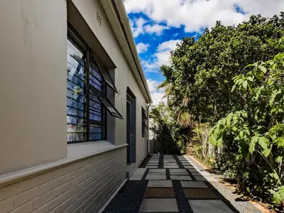 a walkway next to a building with a window at Urban Oaks in Bellville