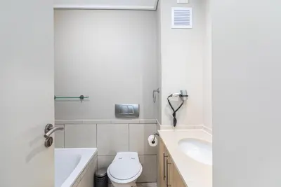 a bathroom with a toilet and a sink at Lagoon Beach 124A by CTHA in Cape Town