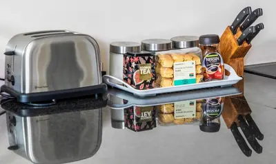 a refrigerator with a tray of food and a toaster at Campbell's Corner in Cape Town