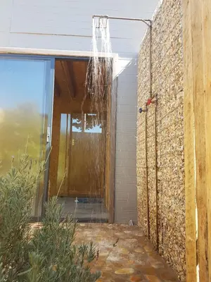 a shower hanging from the side of a building at PicardiPlace in Rawsonville