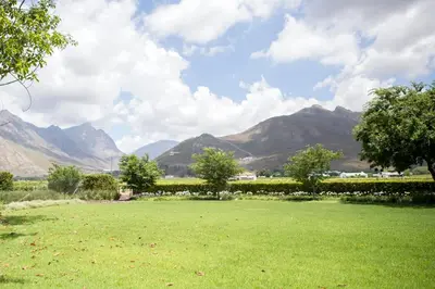 a field of grass with mountains in the background at PicardiPlace in Rawsonville