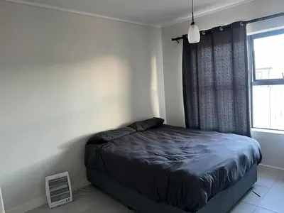 a bedroom with a bed and a window at The black and white suite in Blackheath