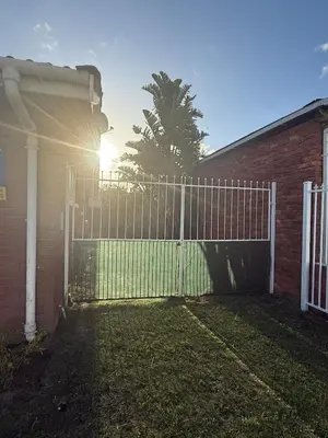 a white fence in front of a house at Spacious 3 Bedroom 2 Bathroom 6 Sleeper in Southfield