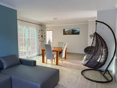 a living room with a couch and a table at Spacious 3 Bedroom 2 Bathroom 6 Sleeper in Southfield