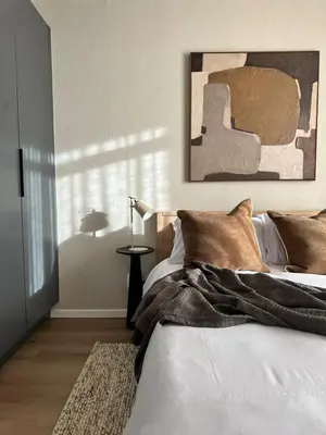 a bedroom with a bed with a blanket on it at Riverlands 2Bedroom Apartment with Mountain Views in Cape Town