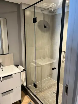 a bathroom with a shower and a sink at Riverlands 2Bedroom Apartment with Mountain Views in Cape Town