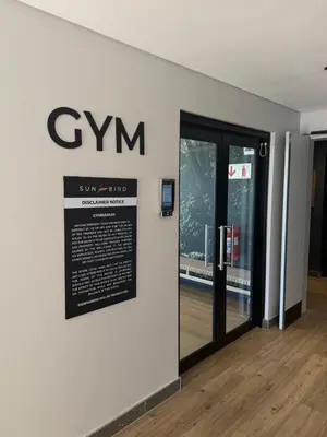 a sign on the side of a building with a door at Riverlands 2Bedroom Apartment with Mountain Views in Cape Town