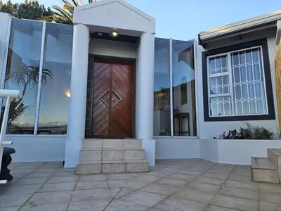 a front door of a house with a wooden door at Fair View 2 in Somerset West