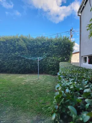 a garden with a wind turbine in a yard at 51 on 6th in Hermanus