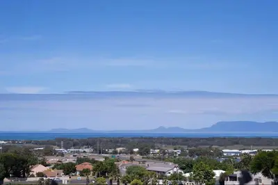 a view of a town with mountains in the distance at Units on 8Wingerd in Somerset West