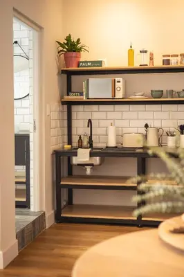 a kitchen with a counter with dishes on it at Waterfront Studios - Hermanus Waterfront Apartments in Hermanus