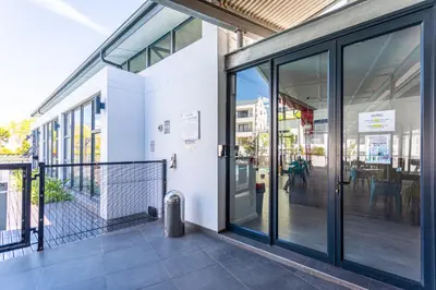 an entrance to a building with sliding glass doors at The Sandown 178 by CTHA in Cape Town