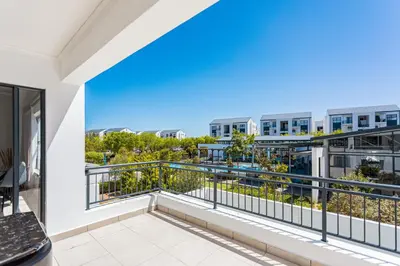 a balcony with a view of a building at The Sandown 178 by CTHA in Cape Town