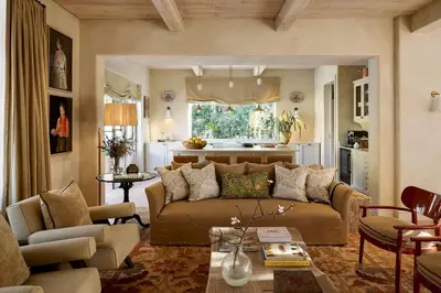 a living room with a couch and a kitchen at Spier Hotel and Wine Farm in Stellenbosch