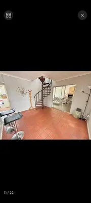 a room with a staircase and a tiled floor at S&R Guesthouse in Cape Town
