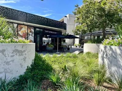 a building with plants in front of it at Cape Town Studio for business travel in Cape Town