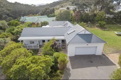 an aerial view of a white house with a garage at Charming Country Escape with Mountain Views in Hermanus