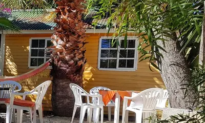 a table and chairs in front of a house at Oh so Heavenly in Cape Town