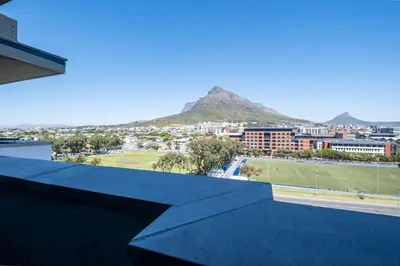 a view of a city with a mountain in the background at 715 Riverlands - Lux 2 Bedroom Apartment in Cape Town