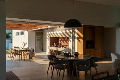 a kitchen and dining room with tables and chairs at 6 on Heide in Franschhoek
