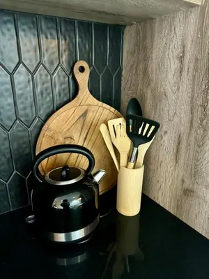 a counter with a tea pot and utensils on it at Little Heaven in Cape Town