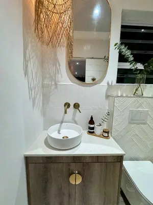 a bathroom with a sink and a mirror at Little Heaven in Cape Town