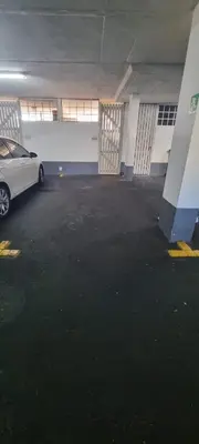 a car parked in a parking lot in a garage at Studio Apartment - Dolphin Beach in Cape Town