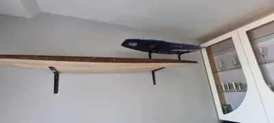 a kayak sitting on a shelf in a room at Studio Kiters Room - Dolphin Beach in Cape Town