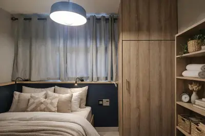 a bedroom with a bed and a large window at PinotageLuxuryCollection 14 Bastmolen in Stellenbosch