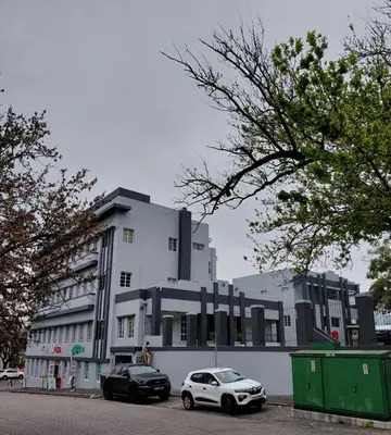 two cars parked in front of a building at Granaat Pit - Paarl - Self Catering Apartment in Paarl