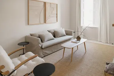 a living room with a couch and a table at Dorpshuis Apartment, Main Street, Paarl in Paarl