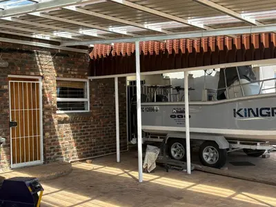 a boat is parked outside of a house at 2 Elwyn Road