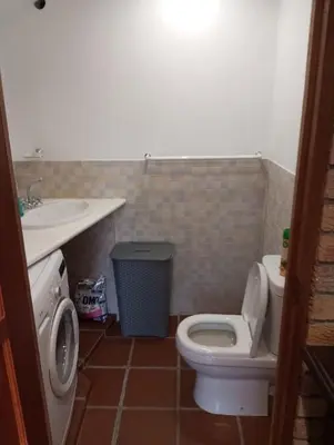 a bathroom with a toilet and a sink at Spacious Self-Catering Apartment with Private Entrance in Peaceful Paradyskloof, Stellenbosch in Stellenbosch