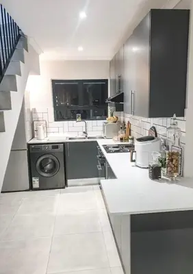 a kitchen with a stove and a dishwasher at Tranquil Luxe Retreat in Cape Town